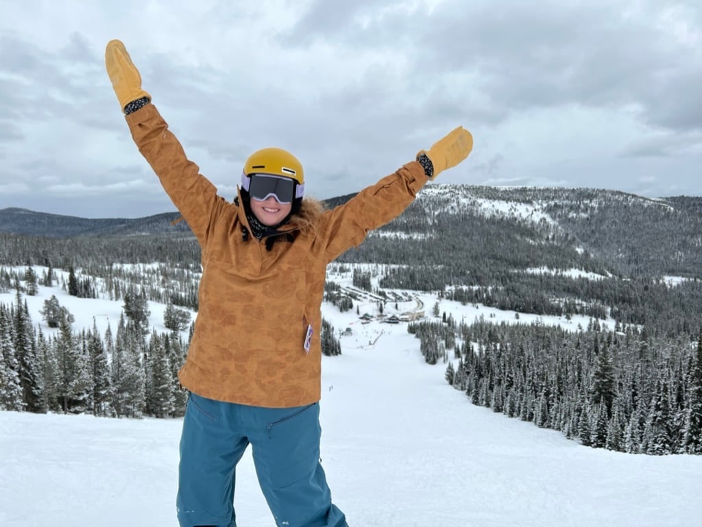 Woman snowboarding at showdown montana