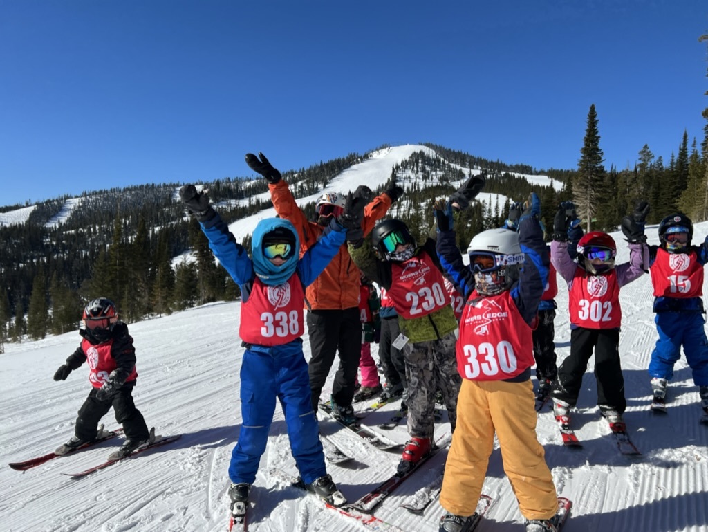 Ski school kids cheering