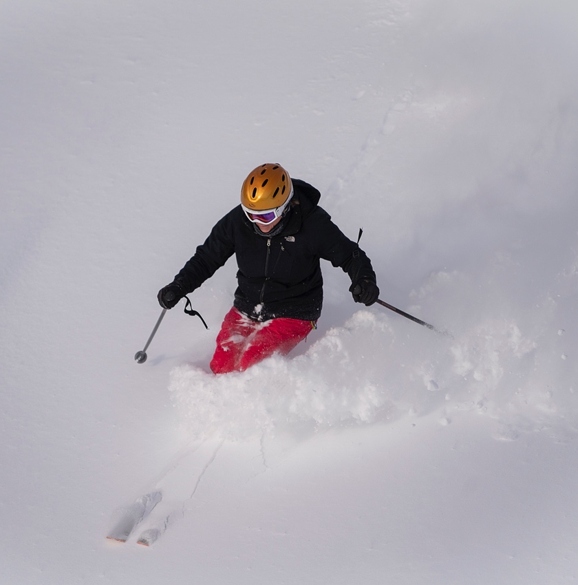 skier in powder at showdown montana